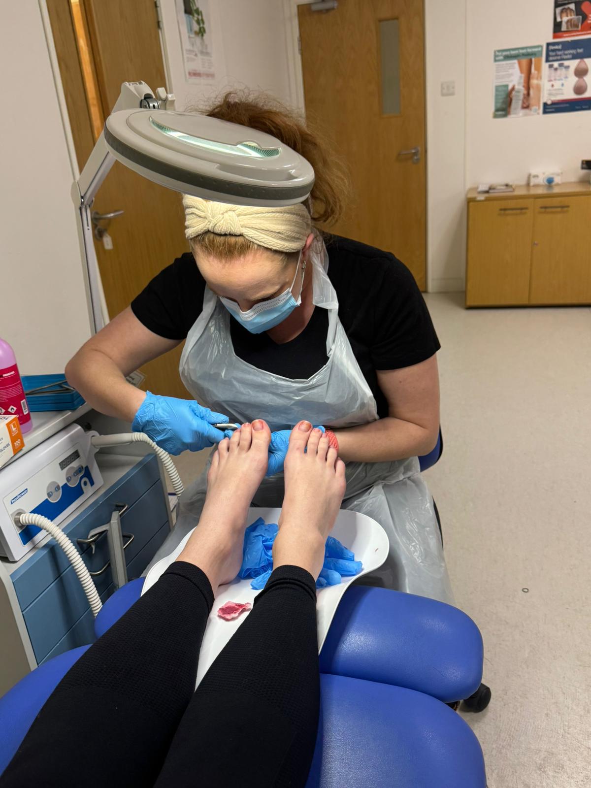 Patient receiving comfortable foot care treatment