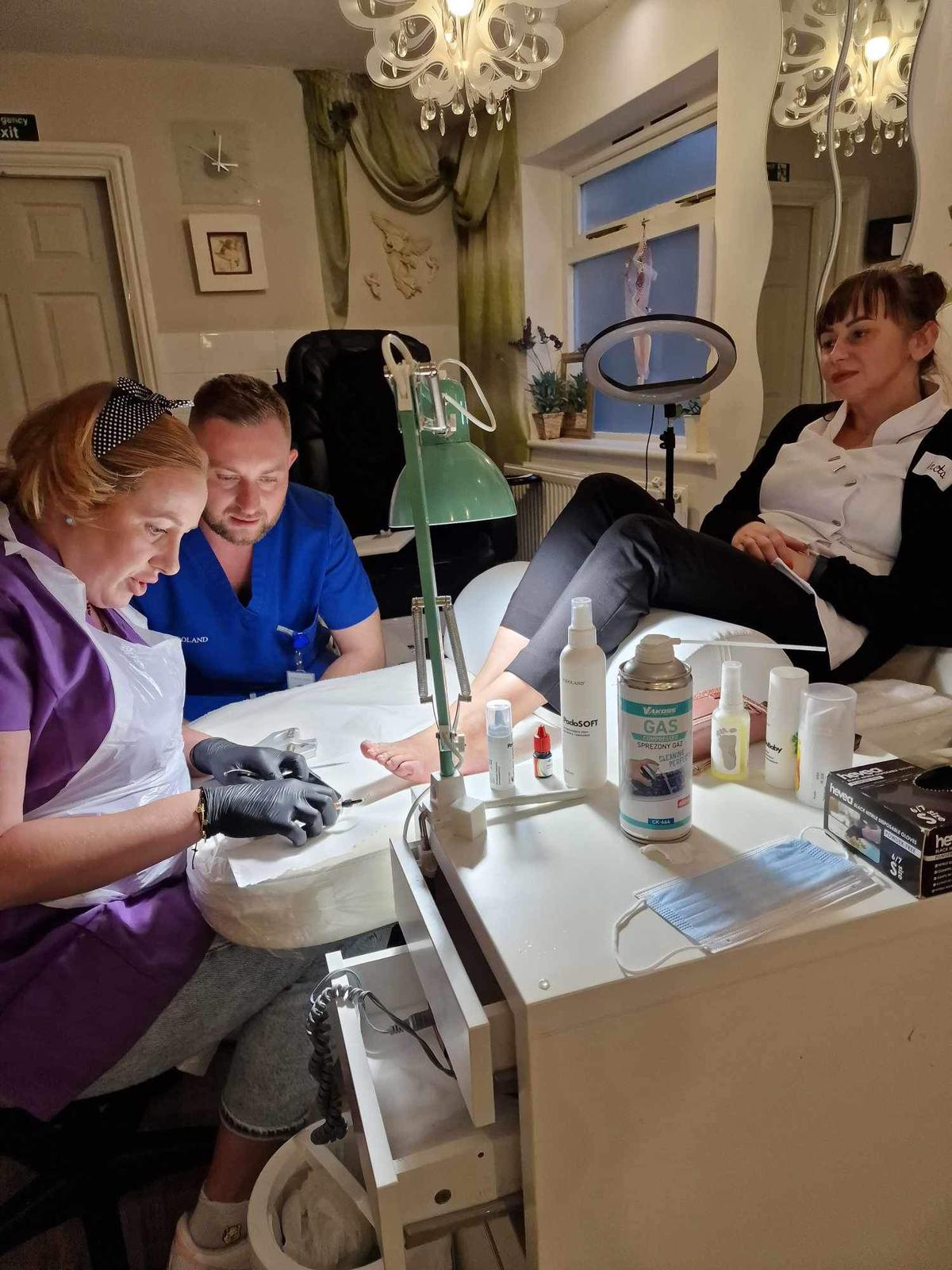 Patient foot resting on support during care